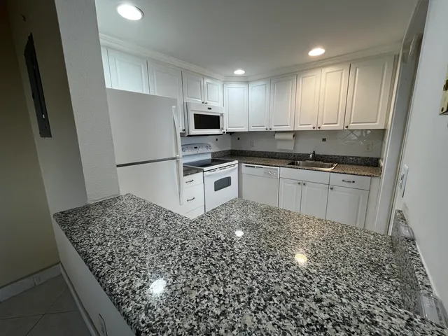 a view of an empty room and floor to ceiling window