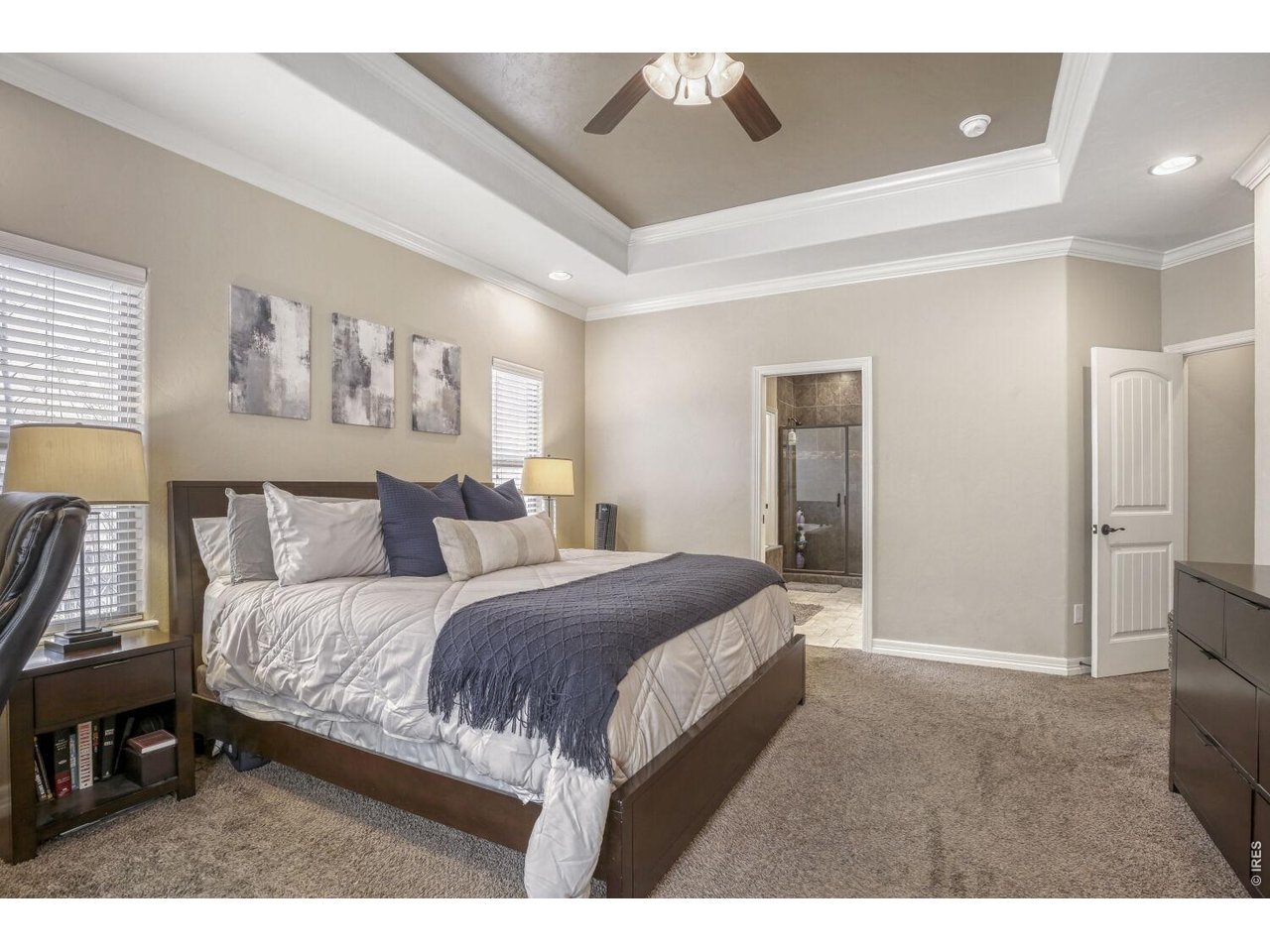 7992 St Street Frederick, CO 80530 - Photo 14 of 28 a bedroom with a bed and a painting on the wall