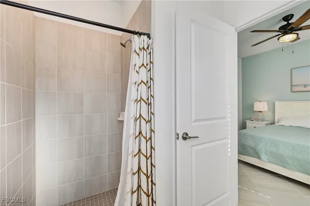 a bathroom with a shower curtain and a sink