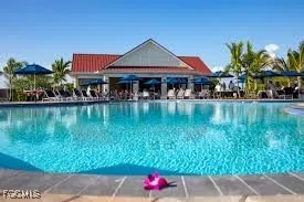 a front view of house with yard and lake view