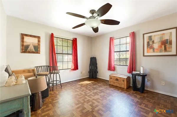a living room with furniture and a window