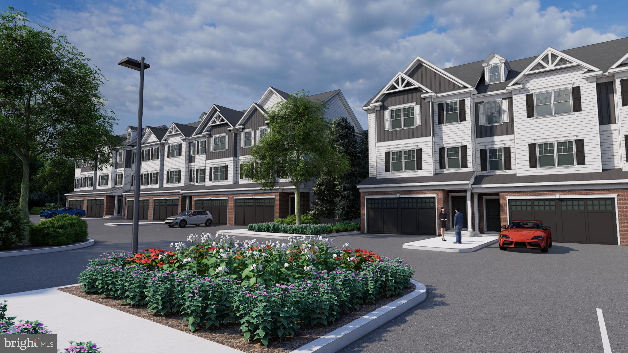 2 West Butler Avenue New Britain, PA 18901 - Photo 2 of 25 Charming townhomes with vibrant landscaping.