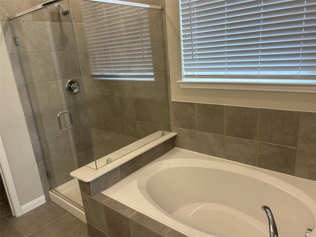 1314 Eagle Pass Drive Rosharon, TX 77583 - Photo 17 of 25 The primary bathroom also includes a separate shower and garden tub