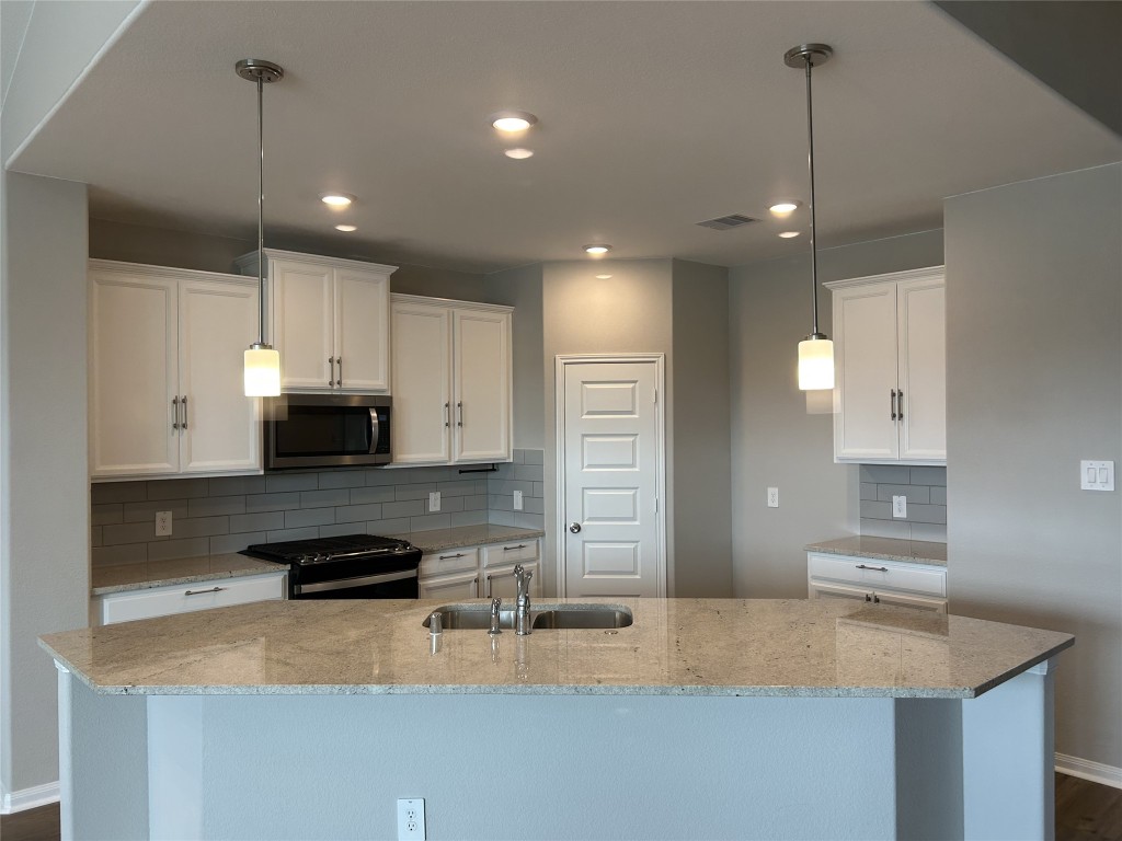 1314 Eagle Pass Drive Rosharon, TX 77583 - Photo 6 of 25 The light and bright ISLAND KITCHEN offers plenty of countertop and cabinet space!