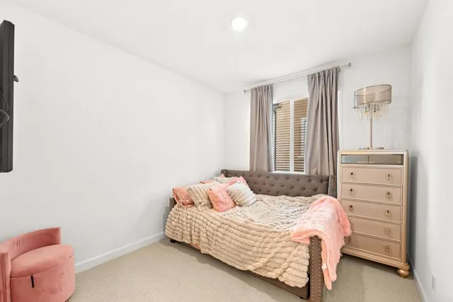 a view of a patio with couches table and chairs and potted plants