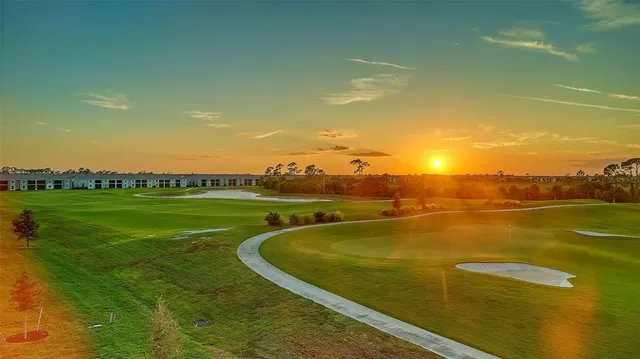 a kitchen with a stove a sink and a refrigerator
