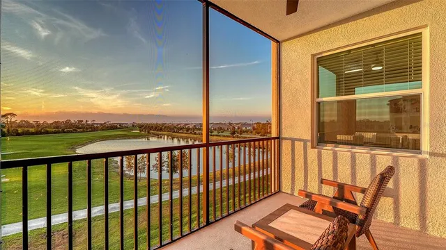 a kitchen with a dining table chairs and refrigerator
