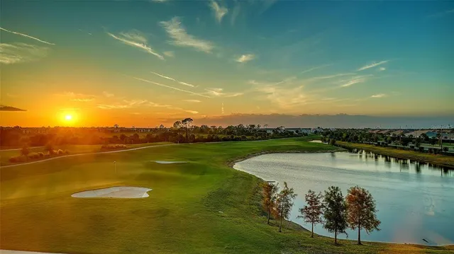 a kitchen with stainless steel appliances granite countertop a sink refrigerator and cabinets