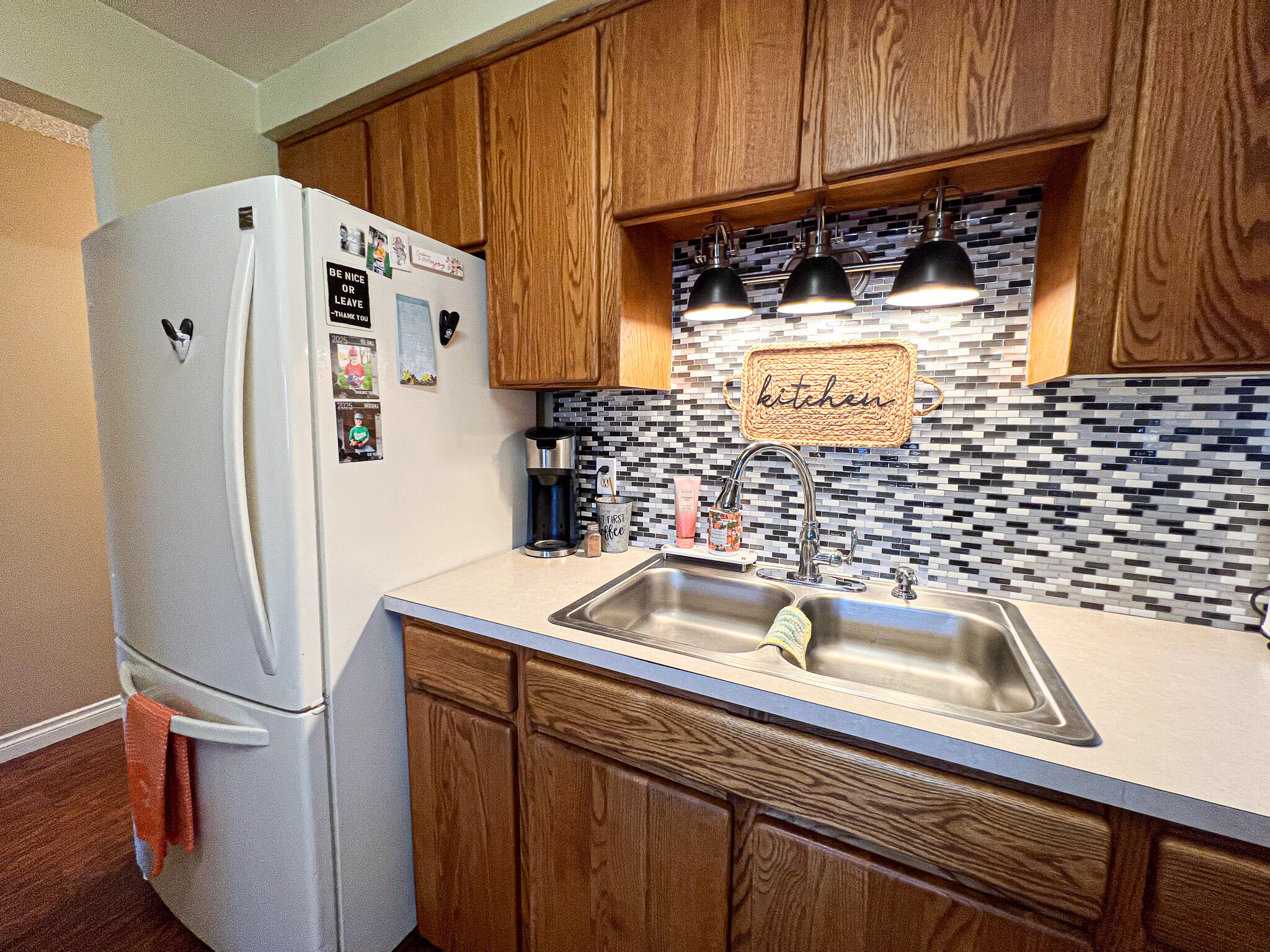 1225 East B Street Fossil, OR 97830 - Photo 10 of 33 a view of a kitchen with a sink and refrigerator