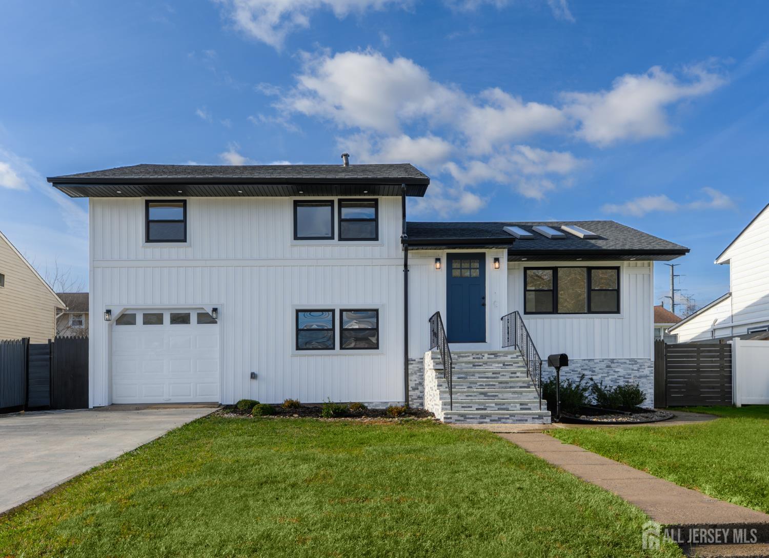 537 Ford Avenue Fords, NJ 08863 - Photo 1 of 35 a front view of a house with a garden
