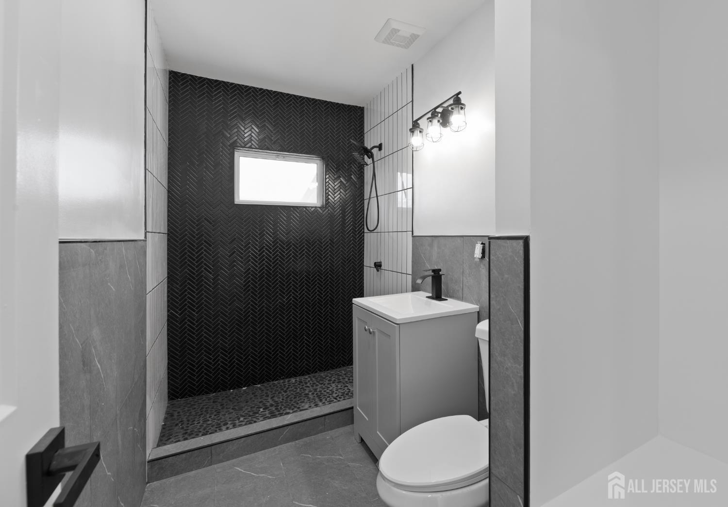 537 Ford Avenue Fords, NJ 08863 - Photo 22 of 35 a bathroom with a toilet sink and shower