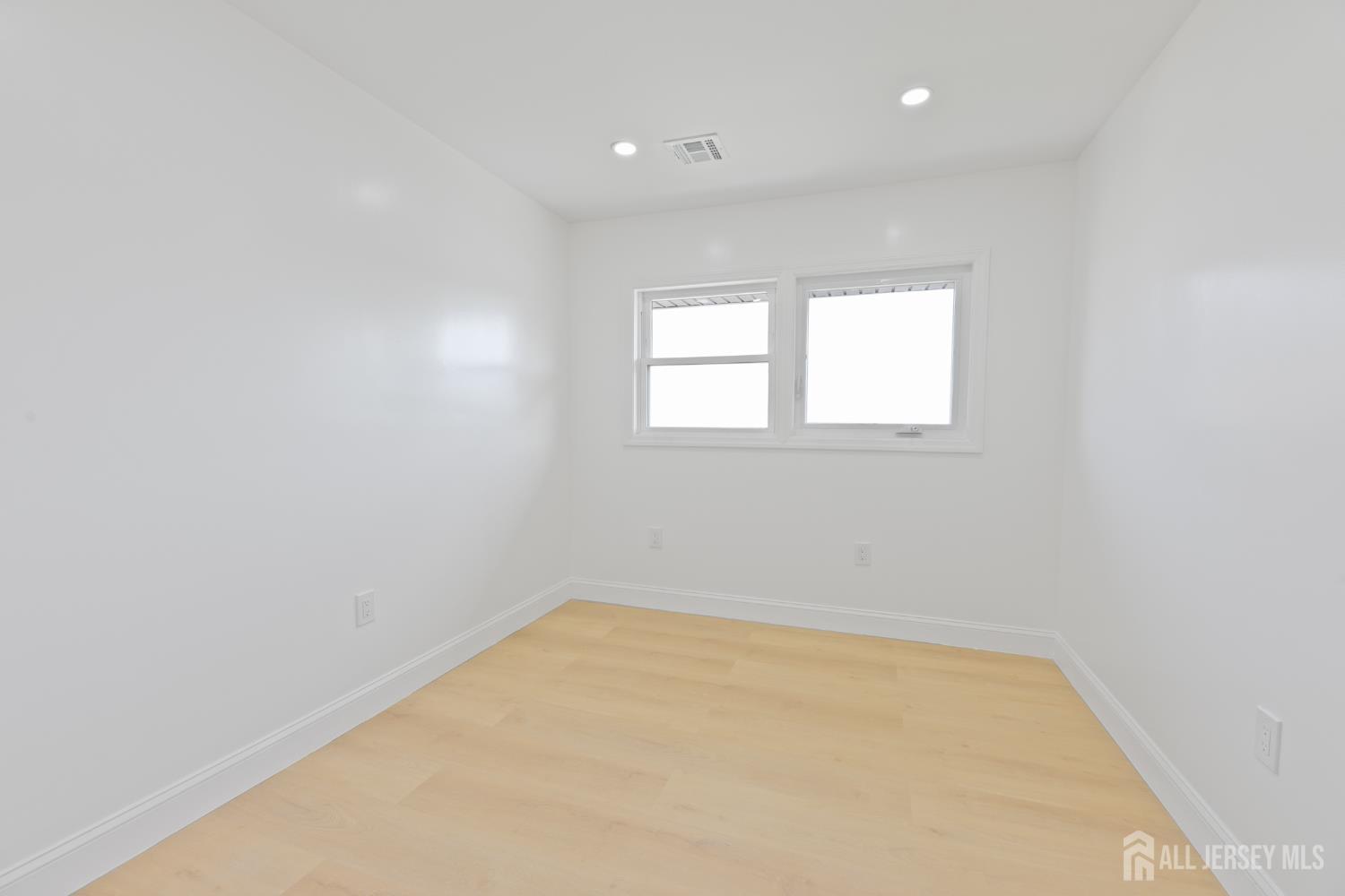 537 Ford Avenue Fords, NJ 08863 - Photo 23 of 35 an empty room with a window