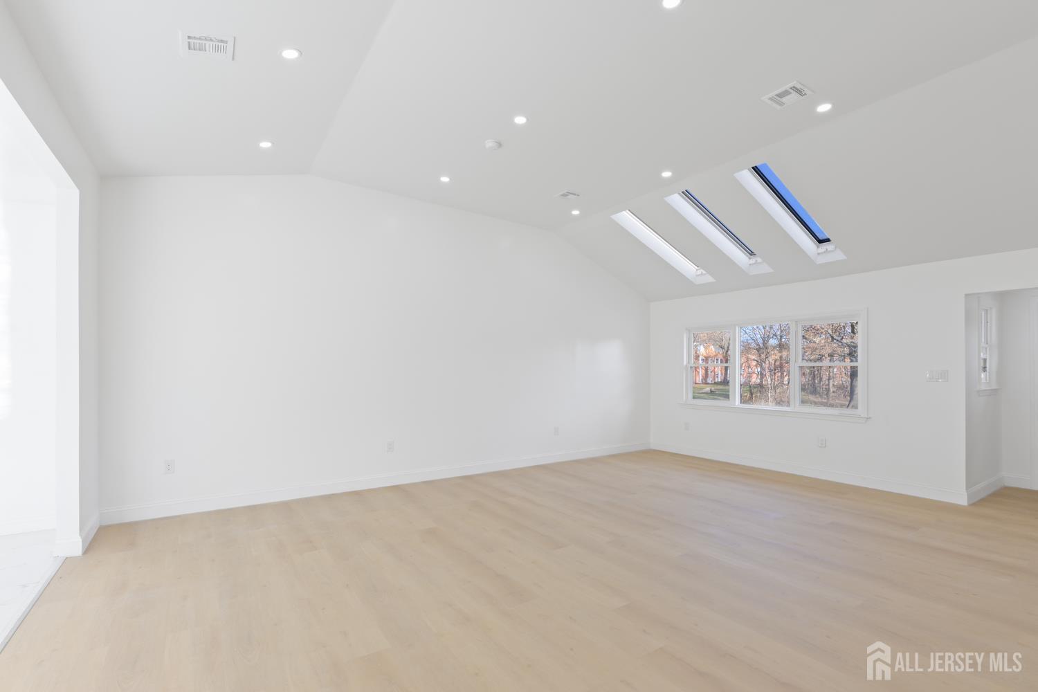 537 Ford Avenue Fords, NJ 08863 - Photo 6 of 35 an empty room with a ceiling fan and a window