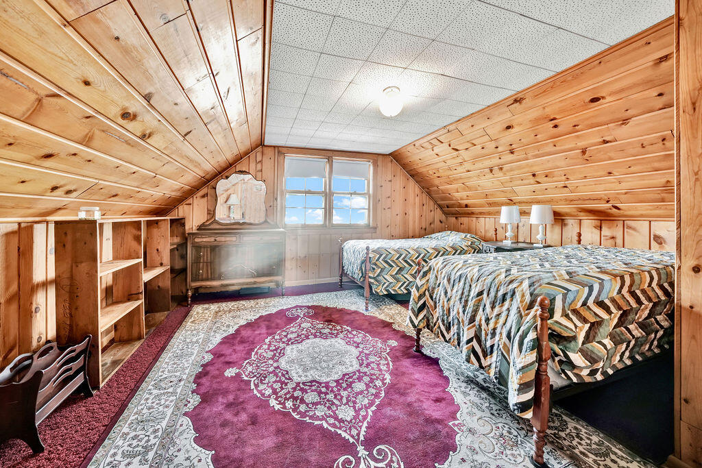 843 173rd Street Hammond, IN 46324 - Photo 11 of 18 a bedroom with a bed next to a window