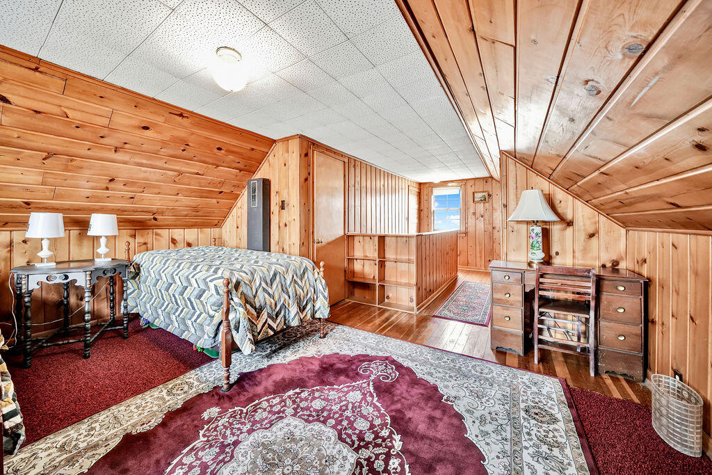 843 173rd Street Hammond, IN 46324 - Photo 12 of 18 a bedroom with furniture and a wooden floor