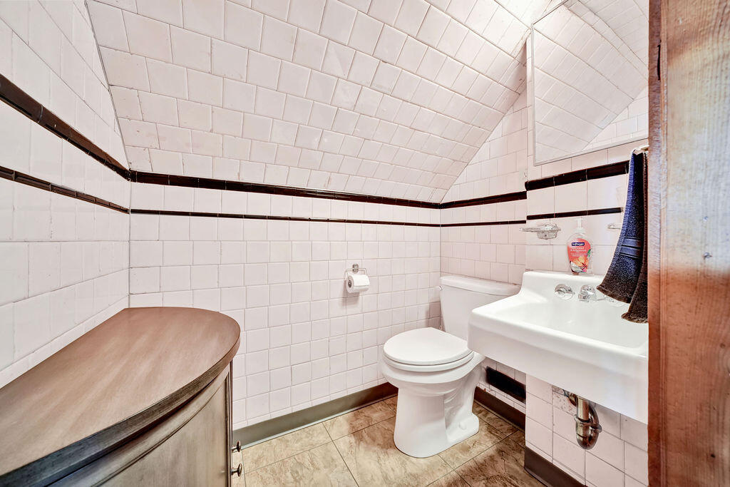 843 173rd Street Hammond, IN 46324 - Photo 13 of 18 a bathroom with a sink toilet and shower