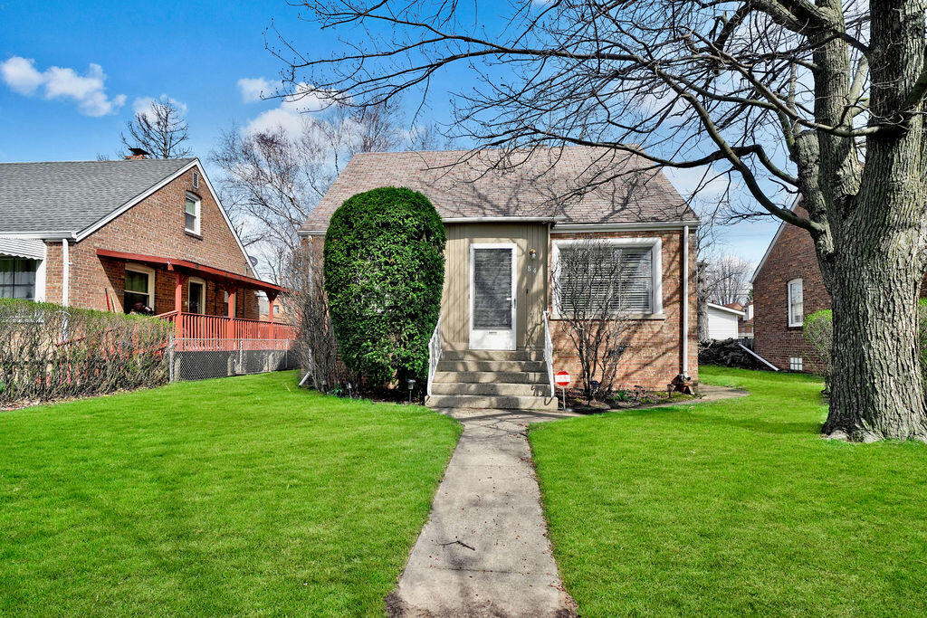 843 173rd Street Hammond, IN 46324 - Photo 2 of 18 a front view of a house with a yard