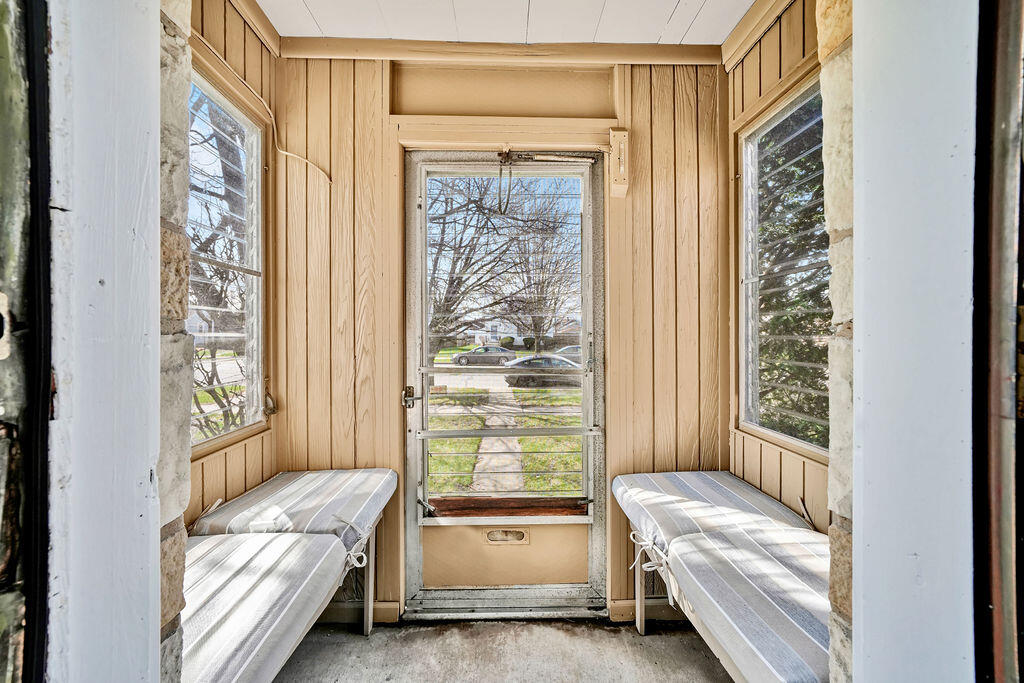 843 173rd Street Hammond, IN 46324 - Photo 4 of 18 a room with a bed and a chair