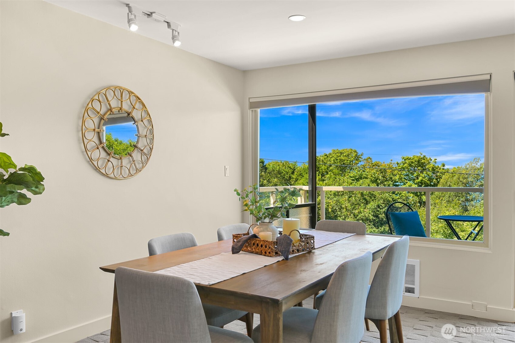 414 Boulevard, Unit 101 Bellingham, WA 98225 - Photo 18 of 32 a view of a dining room with furniture and a potted plant