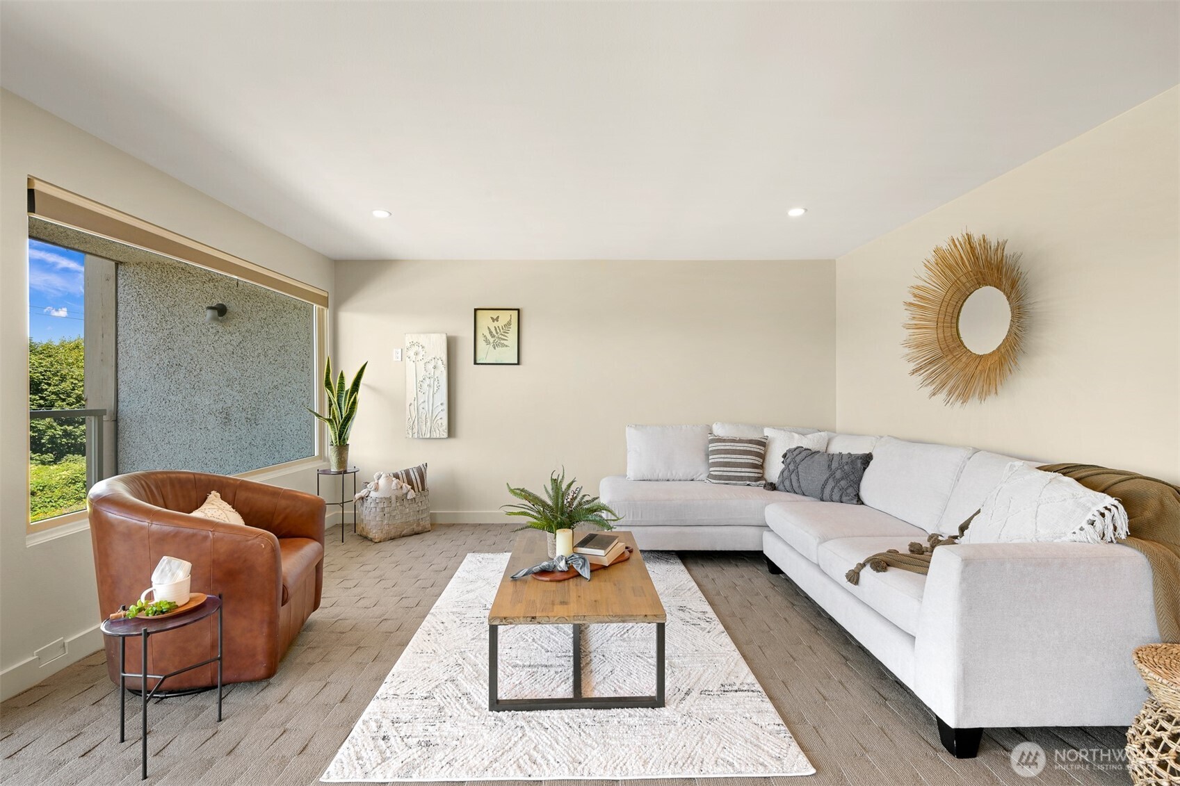 414 Boulevard, Unit 101 Bellingham, WA 98225 - Photo 21 of 32 a living room with furniture rug and wooden floor