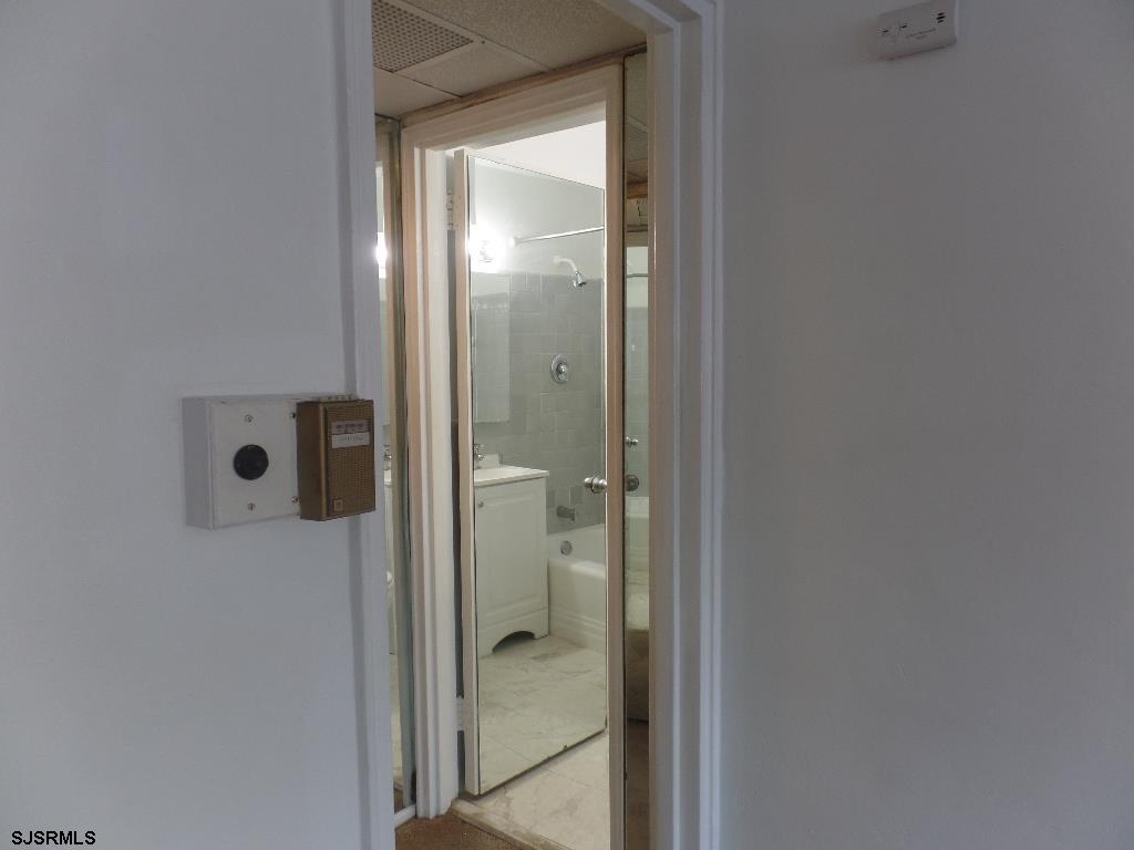 101 South Raleigh Avenue, Unit 221 Atlantic City, NJ 08401 - Photo 12 of 14 a bathroom with a glass shower door