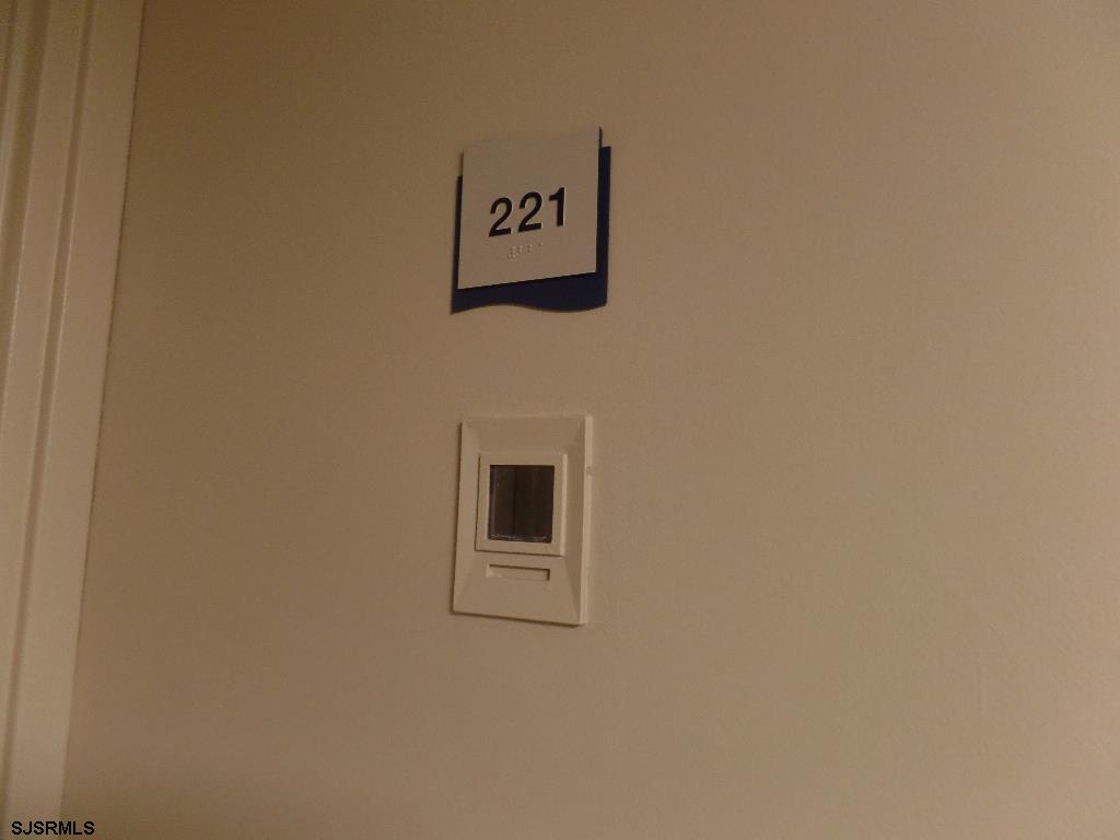 101 South Raleigh Avenue, Unit 221 Atlantic City, NJ 08401 - Photo 3 of 14 a wall with a sign on it