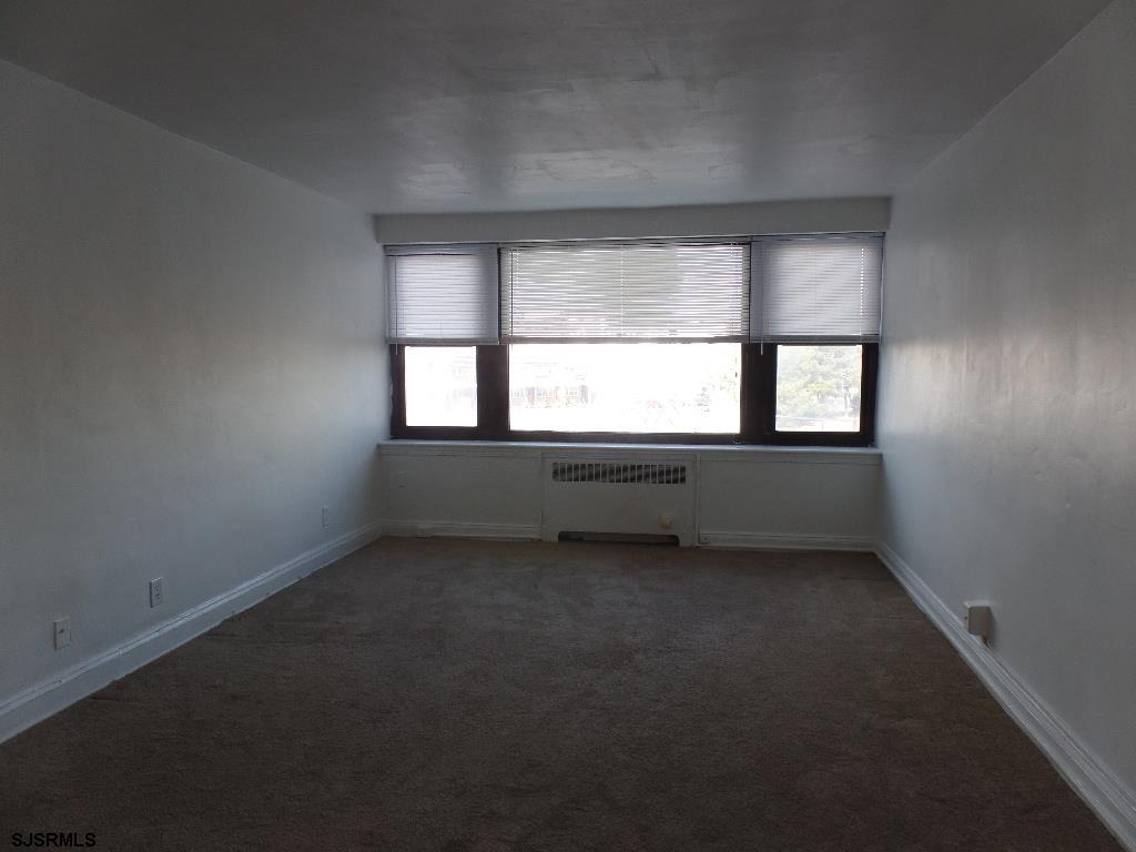 101 South Raleigh Avenue, Unit 221 Atlantic City, NJ 08401 - Photo 9 of 14 an empty room with a window