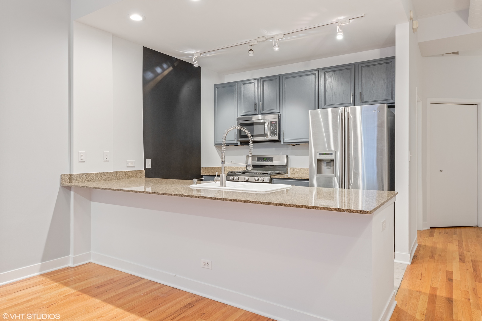 847 West Monroe Street, Unit 3A Chicago, IL 60607 - Photo 11 of 19 a kitchen with stainless steel appliances granite countertop a refrigerator and a sink