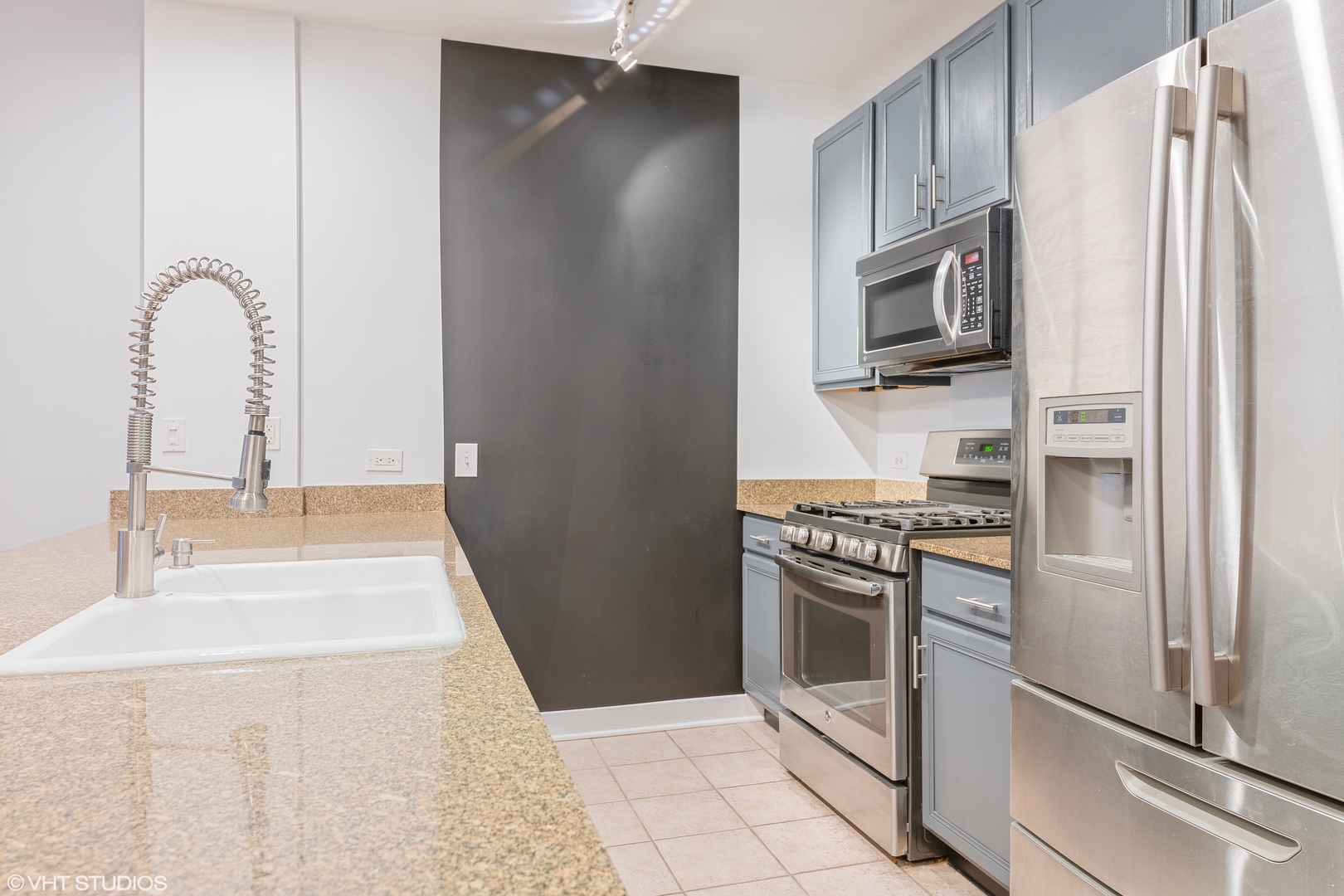 847 West Monroe Street, Unit 3A Chicago, IL 60607 - Photo 12 of 19 a kitchen with stainless steel appliances granite countertop a refrigerator and a stove