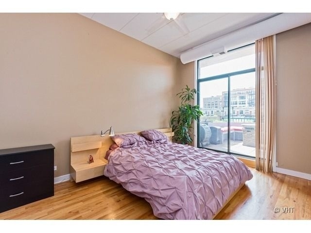 847 West Monroe Street, Unit 3A Chicago, IL 60607 - Photo 14 of 19 a bedroom with a bed and a window