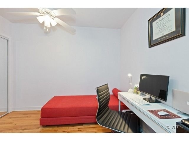 847 West Monroe Street, Unit 3A Chicago, IL 60607 - Photo 18 of 19 a bedroom with a bed and a chandelier