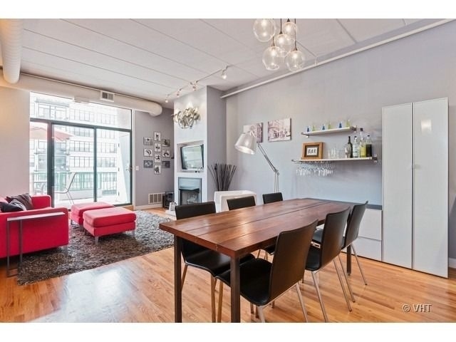 847 West Monroe Street, Unit 3A Chicago, IL 60607 - Photo 4 of 19 a view of a dining room with furniture and wooden floor