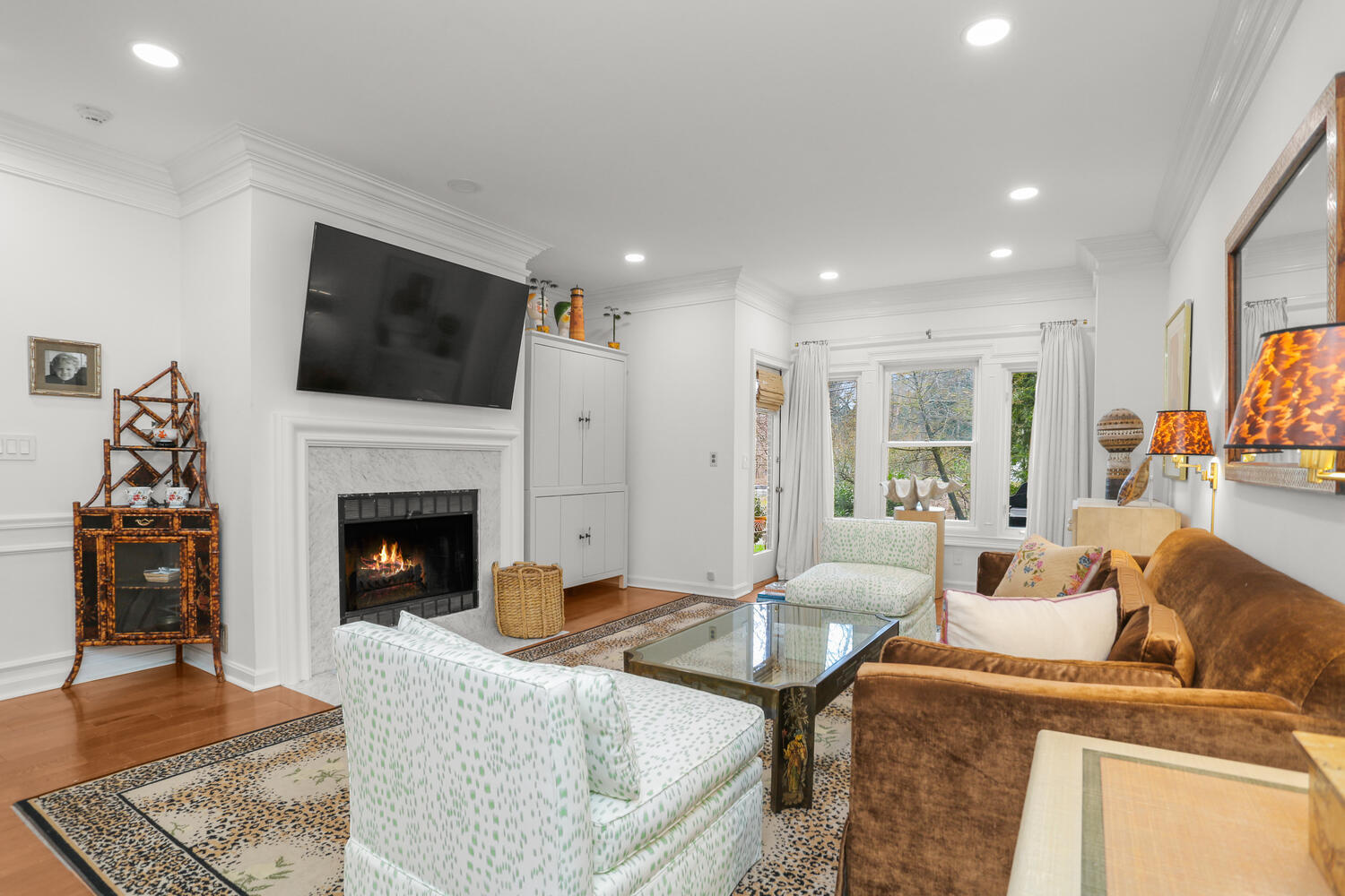 3 Pine Brook Lane Darien, CT 06820 - Photo 4 of 26 a living room with furniture a flat screen tv and a fireplace