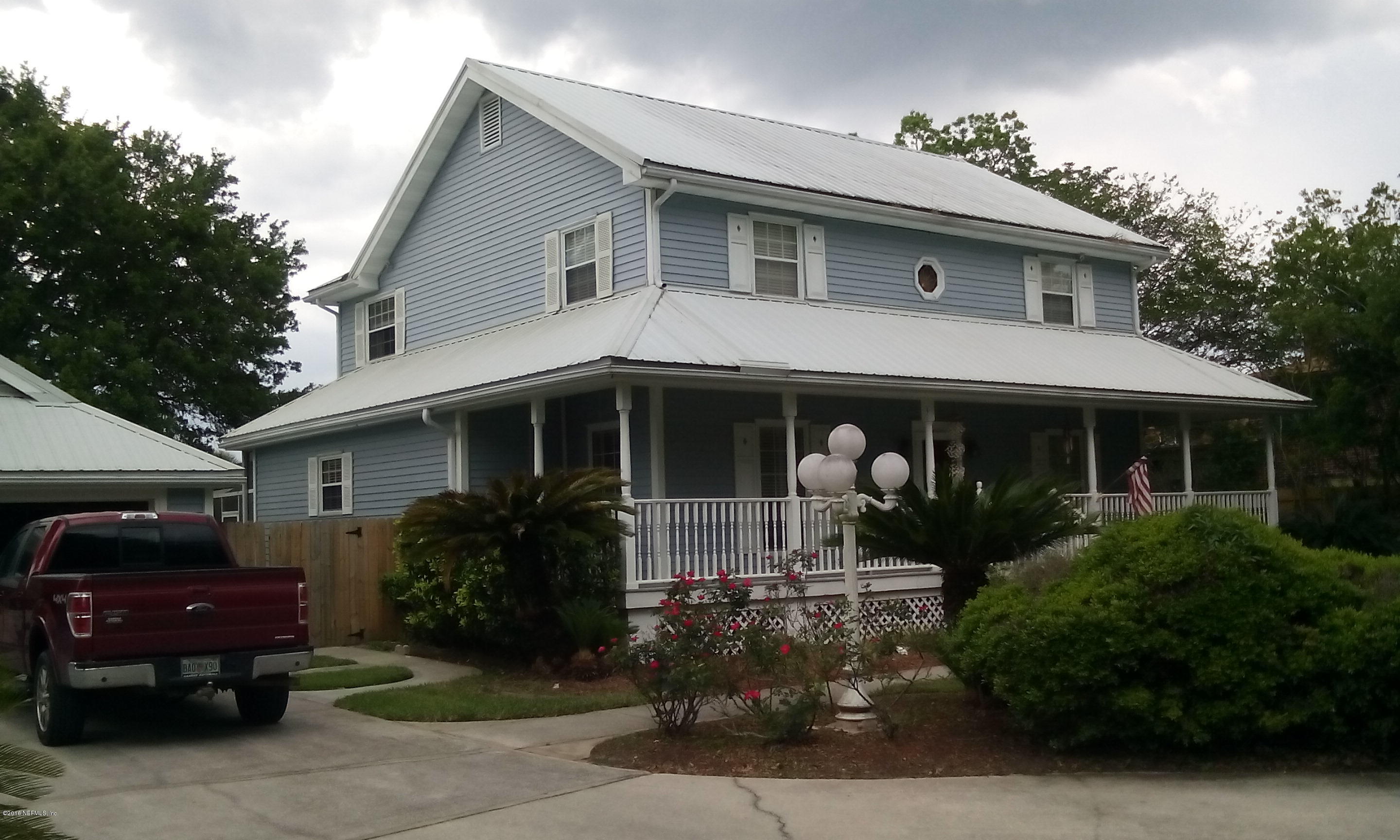 275 Brickyard Road Middleburg, FL 32068 - Photo 1 of 44 a front view of a house with garden