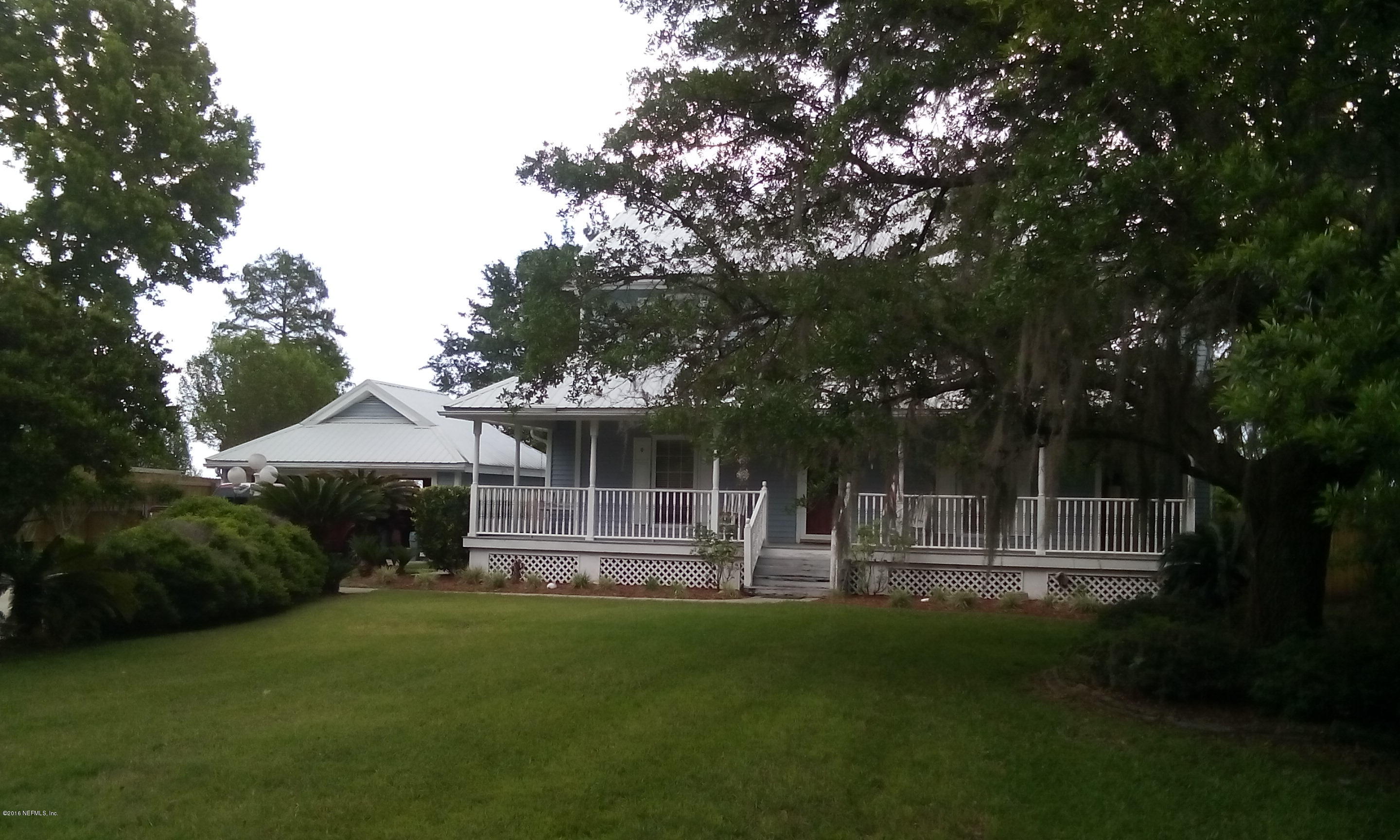 275 Brickyard Road Middleburg, FL 32068 - Photo 12 of 44 a front view of a house with a yard