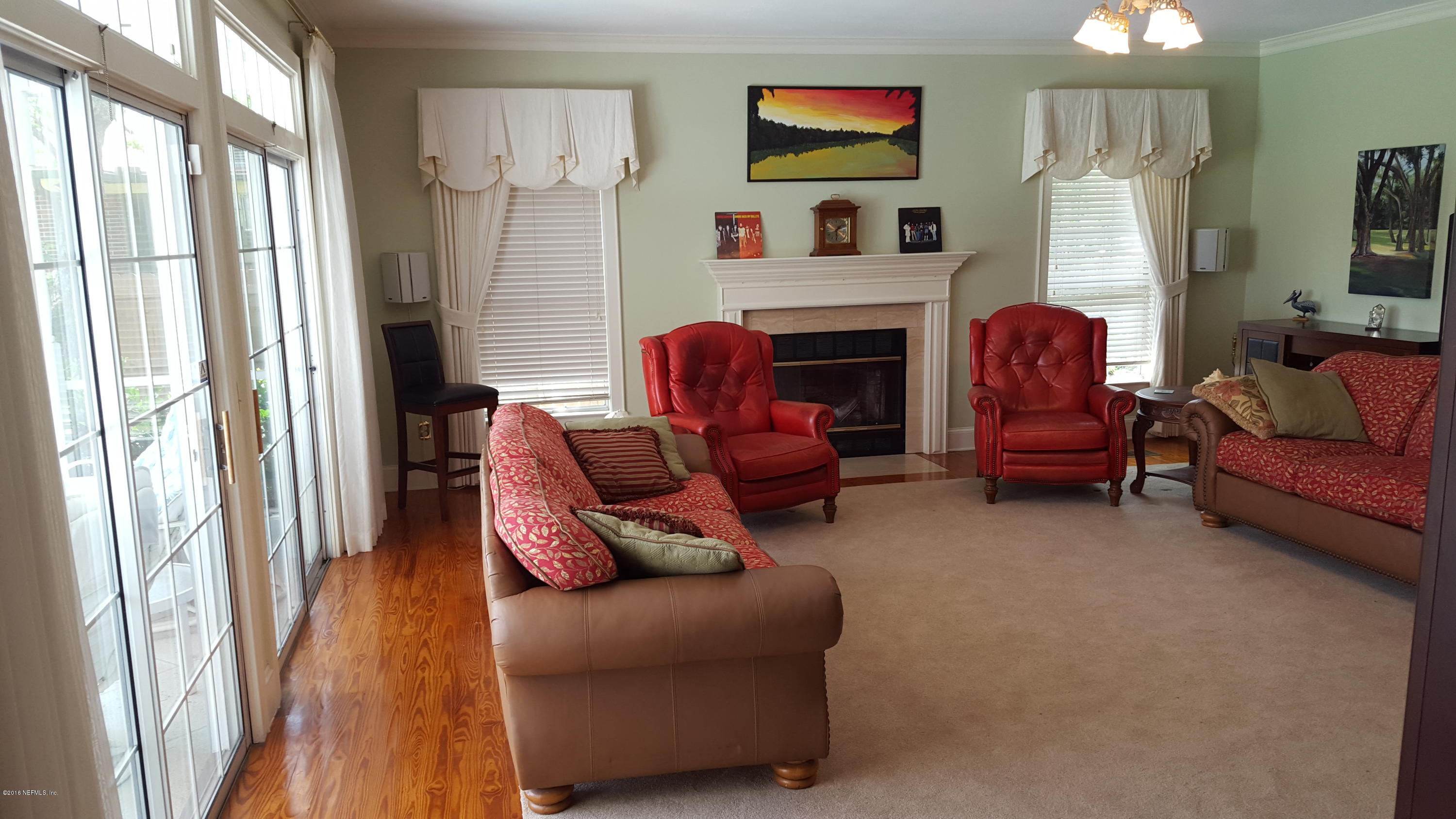 275 Brickyard Road Middleburg, FL 32068 - Photo 18 of 44 a living room with furniture and a flat screen tv