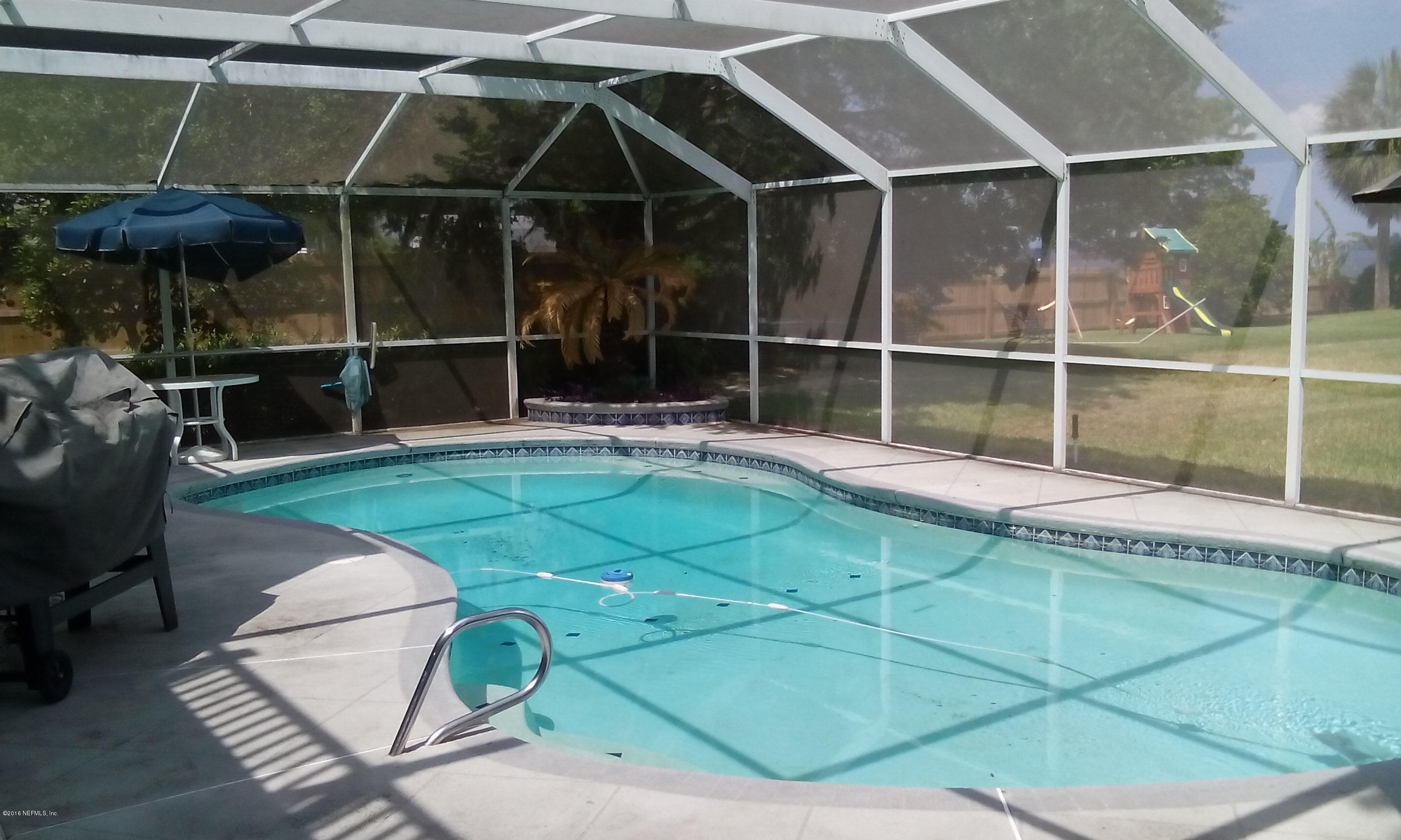 275 Brickyard Road Middleburg, FL 32068 - Photo 4 of 44 a backyard of a house with table and chairs