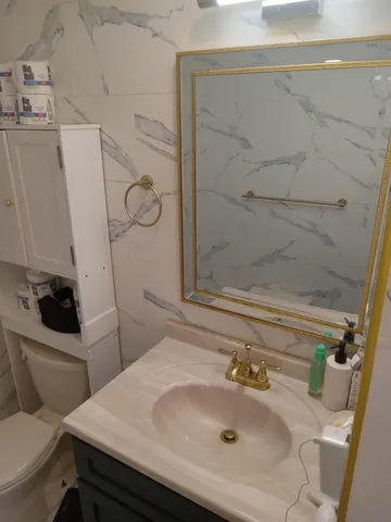 a bathroom with a sink and toilet