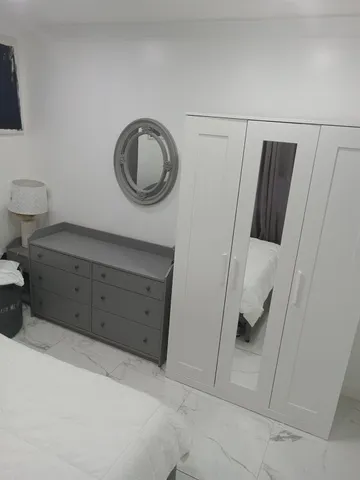 a view of a storage and utility room with a sink