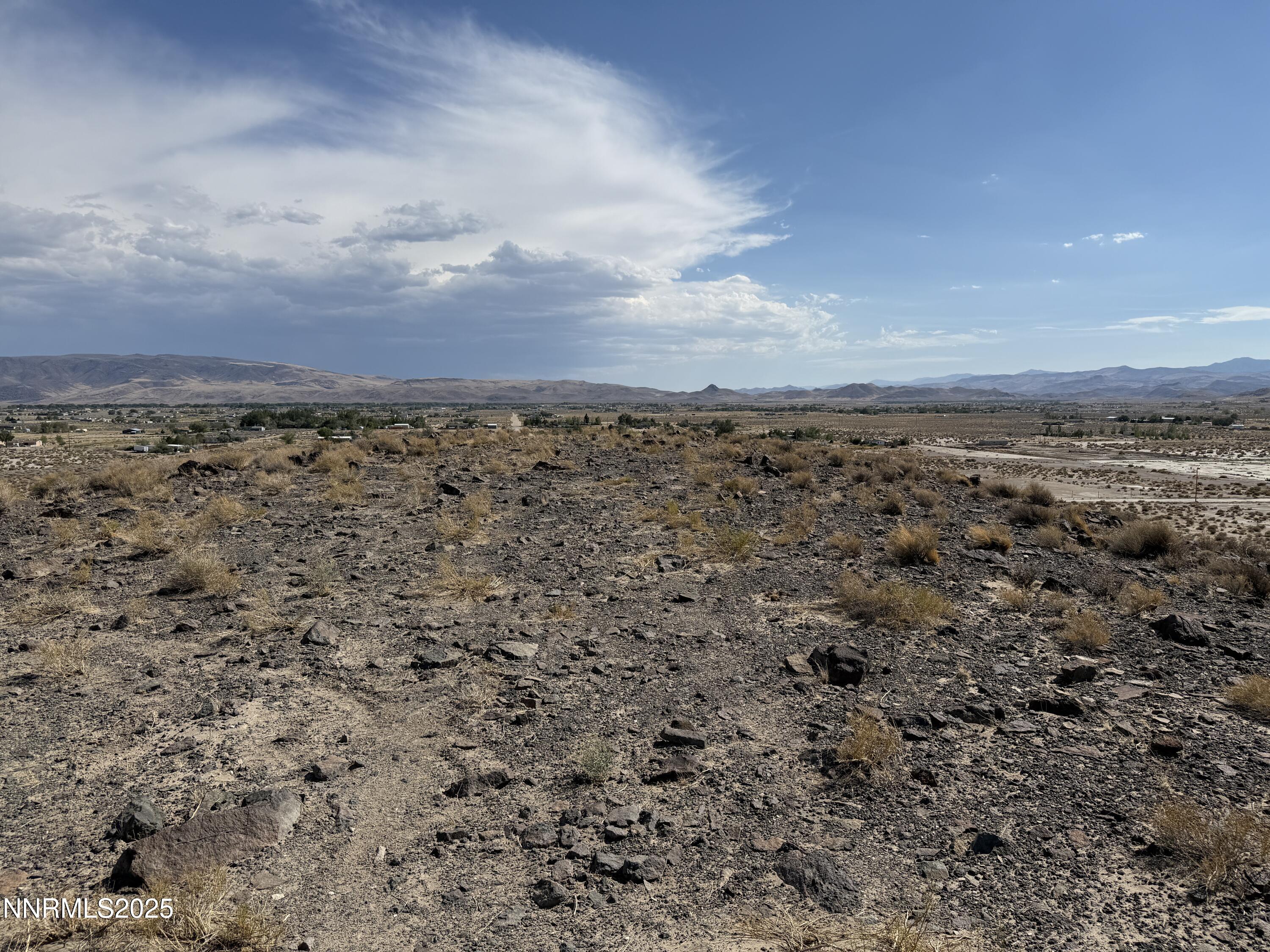 6310 Catfish Street Silver Springs, NV 89429 - Photo 3 of 4 a view of a yard with wooden fence