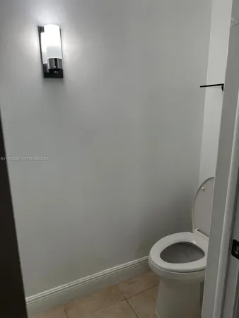 a bathroom with a toilet and a sink