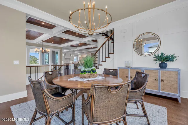 a kitchen with granite countertop a sink appliances cabinets and furniture