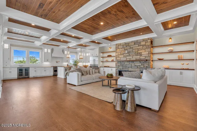 a kitchen with stainless steel appliances a stove a sink and a refrigerator