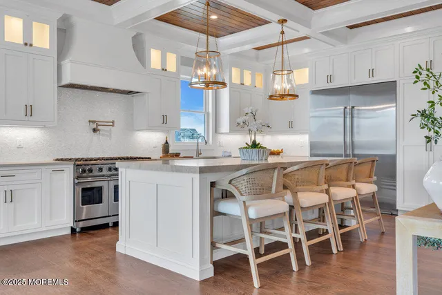 a kitchen with a sink and a potted plant