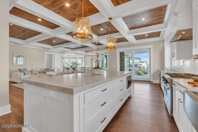 a bathroom with a double vanity sink toilet and shower