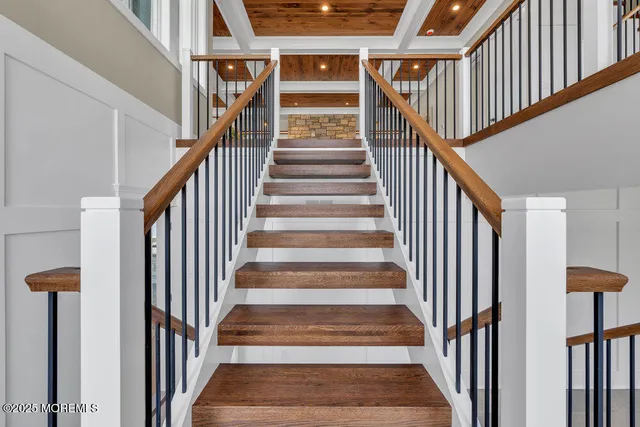 an empty room with closet and windows