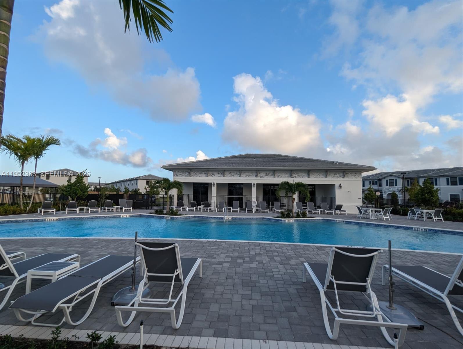 28661 Southwest 132nd Place Homestead, FL 33033 - Photo 16 of 16 a view of a patio with table and chairs with wooden floor and fence