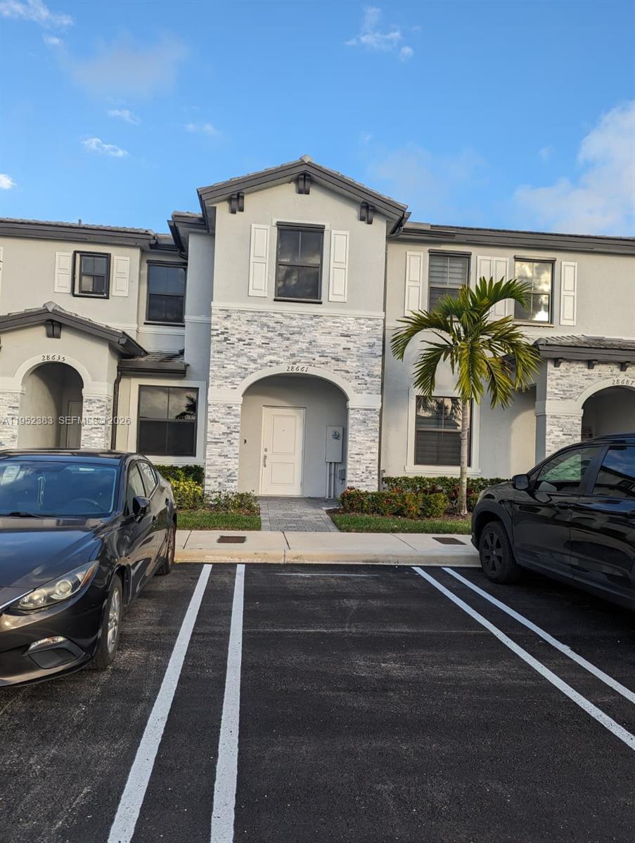 28661 Southwest 132nd Place Homestead, FL 33033 - Photo 2 of 16 a front view of a house with garden