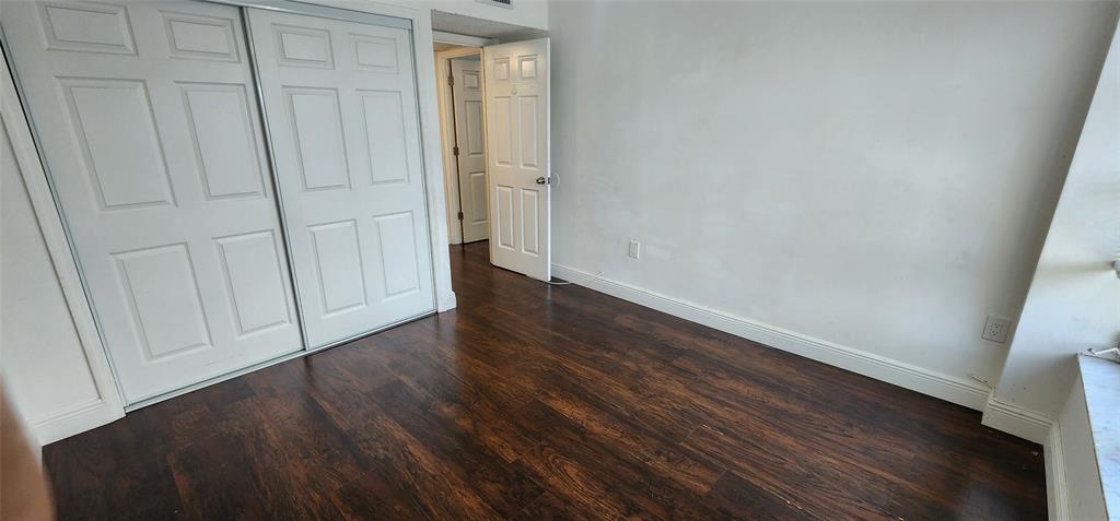 4168 Inverrary Drive, Unit 401 Lauderhill, FL 33319 - Photo 14 of 22 a view of an empty room with wooden floor
