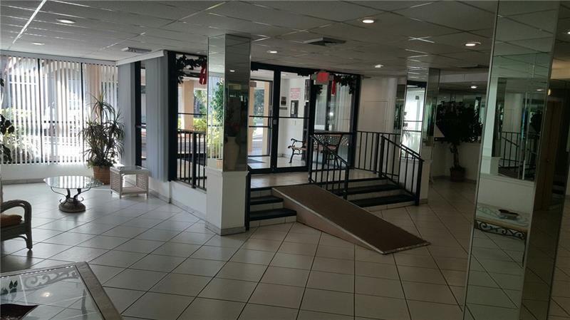 4168 Inverrary Drive, Unit 401 Lauderhill, FL 33319 - Photo 2 of 22 a lobby with furniture